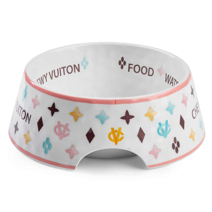 White Chewy Vuiton dog bowl with colorful pattern, available in three sizes, chip-resistant melamine, BPA-free, non-skid bottom.