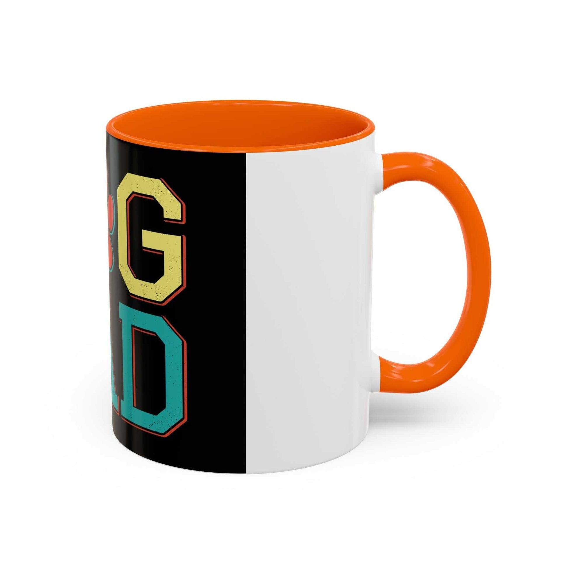 White ceramic mug with orange interior and handle, featuring "Dog Dad" design in bold letters.