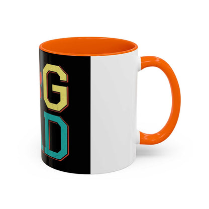 White ceramic mug with orange interior and handle, featuring "Dog Dad" design in bold letters.