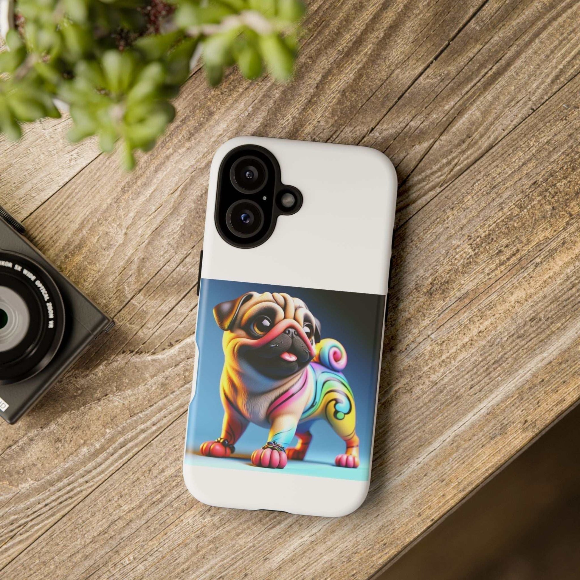 Pug dog phone case with 3D design on wooden table.