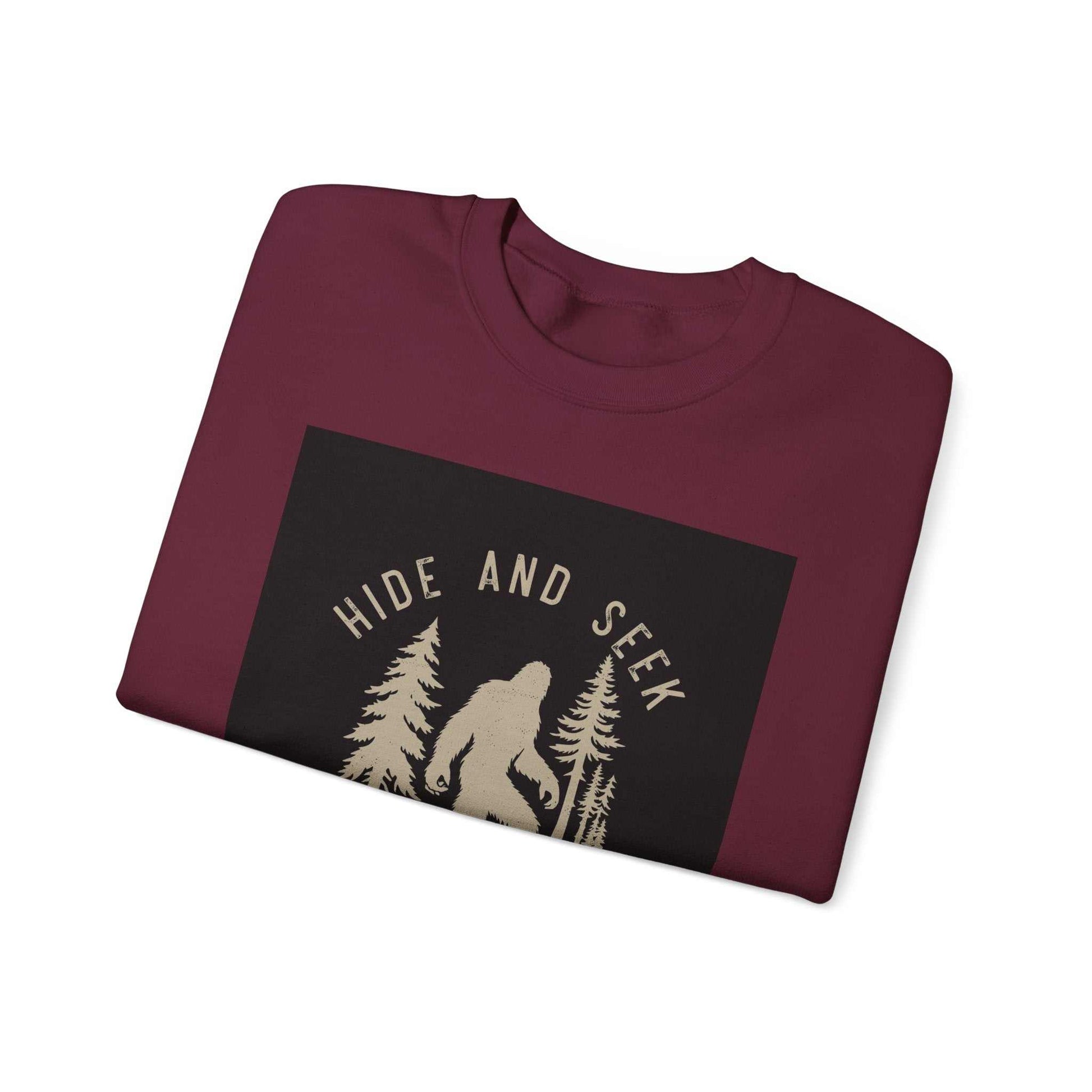Unisex Heavy Blend™ Crewneck Sweatshirt with "Hide and Seek" design, folded.