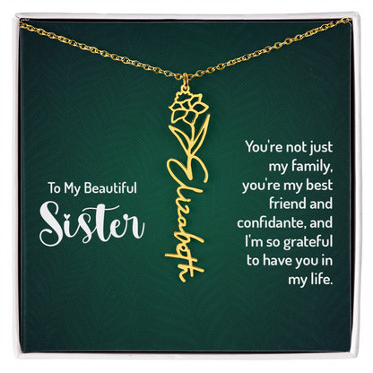 Personalized sister necklace with gold floral design and custom name.